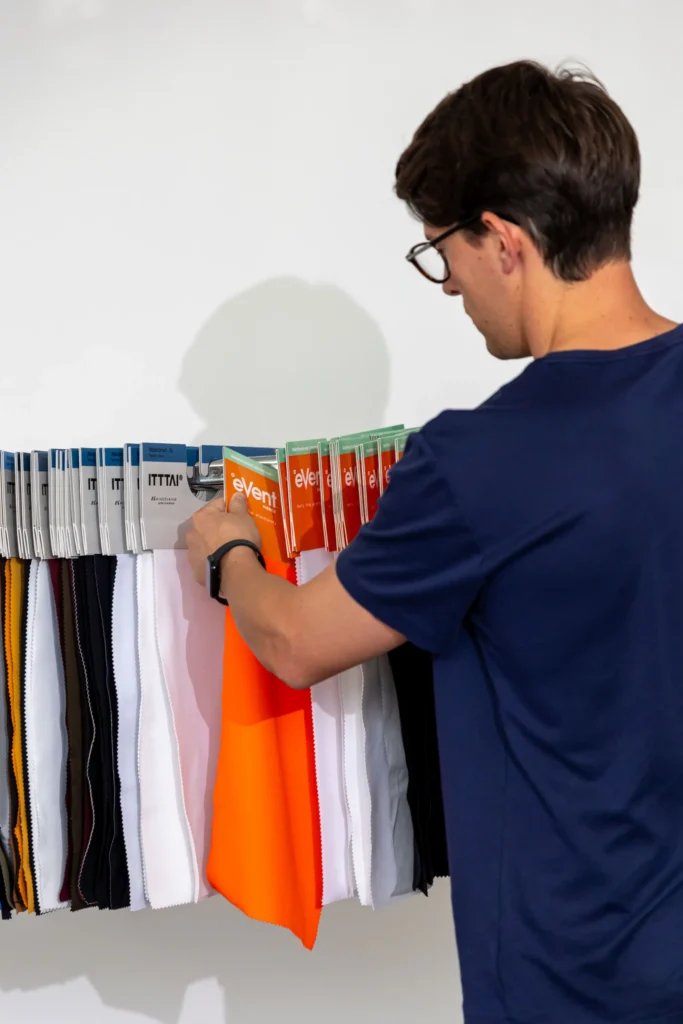 eVent x ITTTAI stormburstLT Summer 2025 - Man Comparing Fabrics